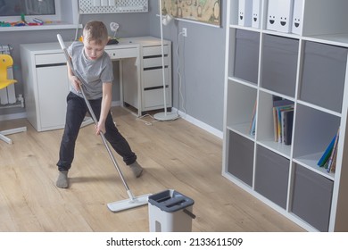 Caucasian Boy Mopping Floors At Home, Child Tidying Up His Room.