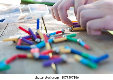 Caucasian Boy Playing With Magnetic Toys Focus On The Hand, On Natural Light.