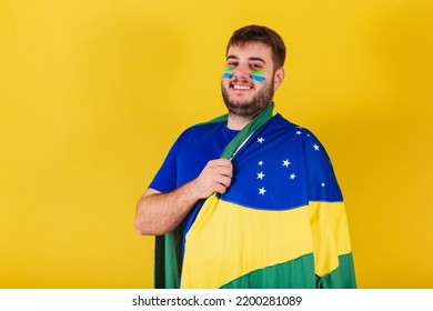 Caucasian Brazilian Man, Soccer Fan From Brazil, Wearing Brazil Flag Cape.