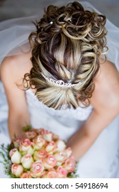 A Caucasian Bride Photographed From Above To Show Off Her Hair