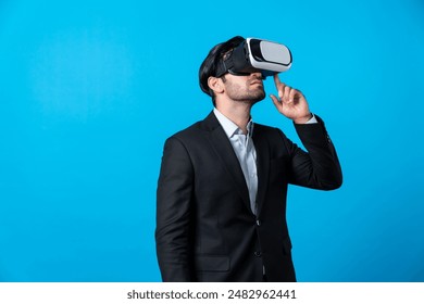 Caucasian business man planning financial plan while using VR goggle. Professional project manager standing and touching VR headset while using visual reality glasses to connect metaverse. Deviation. - Powered by Shutterstock