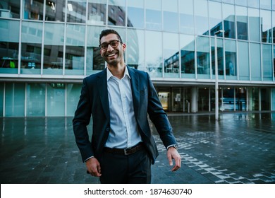 Caucasian Business Man Wearing Spectacles Laughing Standing Outside Banking Office Block Before Work Shift 