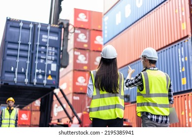 Caucasian business man and woman worker working in container terminal. Attractive engineer people processes orders and product at warehouse logistic in cargo freight ship for import export in harbor.
 - Powered by Shutterstock