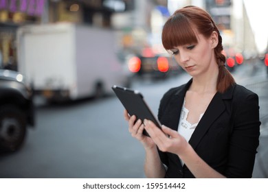 Caucasian Business Woman In New York City Using Ipad Tablet Pc Computer Reading Ebook