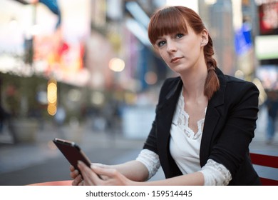 Caucasian Business Woman In New York City Using Ipad Tablet Pc Computer Reading Ebook