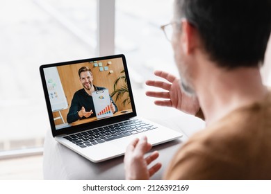 Caucasian Businessman Boss CEO Freelancer E-learning Having Videocall Conference Conversation Meeting Online On Laptop With Colleague Teacher Tutor Showing Charts Remotely On Distance Watching Webinar