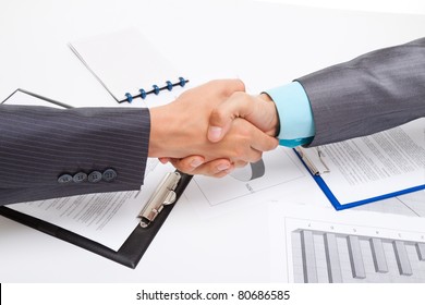 caucasian businessmen handshake after sign contract, isolated on white and business background, with clipboard, documents and empty copy space. Communication, greeting, agree, congratulation concept.