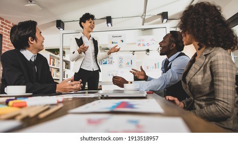 Caucasian Businesswoman Lead The Meeting By Using Whiteboard Graphs As Documents. The Atmosphere In The Meeting Room Is Happy And Fun In The Office Meeting Room. Concept Happy And Fun Meeting