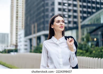 Caucasian Businesswoman Walking Alone With Confidence Outdoors In City. Attractive Beautiful Woman Employee Worker People Feel Happy And Relax While Spend Leisure Time Walk Outside To Office Company.