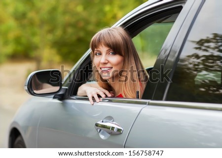 Caucasian car driver woman smiling 
