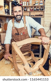caucasian carpenter at work in a workshop