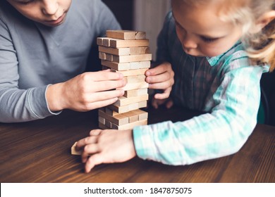 Caucasian Children, Boy And Girl Playing Jenga And Smiling, Block Stacking Game, While Staying At Home During Quarantine, Home Family Activity, Party Board Offline Game Concept