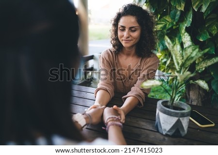 Caucasian coacher have theta holistic healing session with client enjoying time for talking and discussing questions during weekend pastime, female friends discussing trust and esoteric assistance