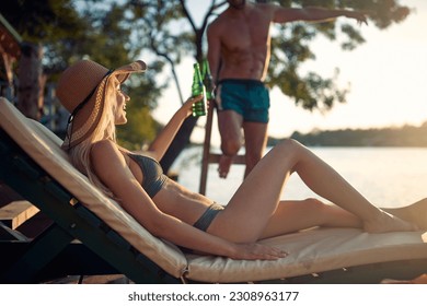 Caucasian couple enjoying the summer holidays together on the beach - Powered by Shutterstock