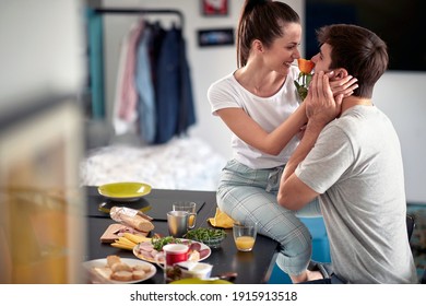 Caucasian couple having romantic breakfast together at home