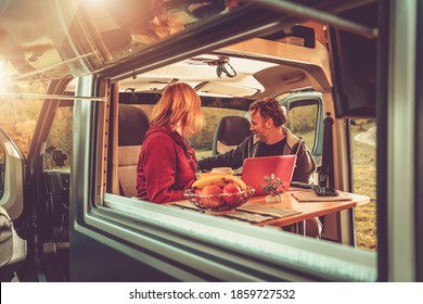 Caucasian Couple Inside Modern Camper Van During Their Wilderness Boondocking Vacation. Recreational Vehicle RV Theme. - Shutterstock ID 1859727532