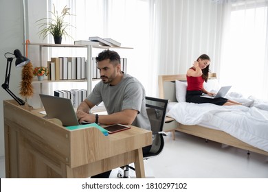 Caucasian couple man and woman working at home - Powered by Shutterstock