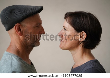 Similar – Man and woman face each other