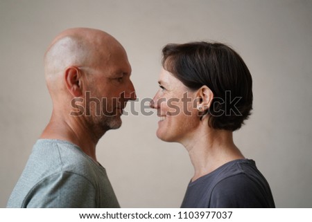 Similar – Man and woman face each other