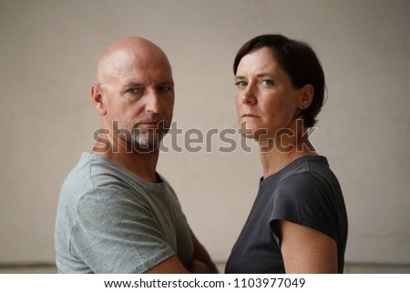 Similar – Man and woman face each other