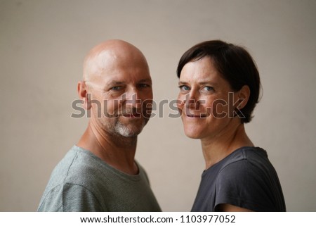 Similar – Man and woman face each other