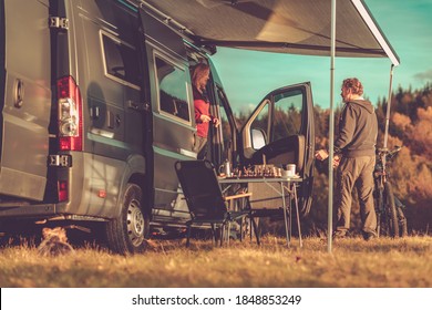 Caucasian Couple and Their Weekend Getaway. Camper Van RV Boondocking in Remote Place During Scenic Fall Foliage. Class B Motorhome RVing Theme. - Shutterstock ID 1848853249