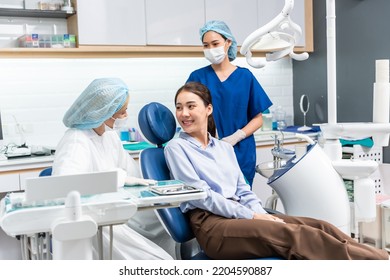 Caucasian dentist examine tooth for young girl at dental health clinic. Attractive woman patient lying on dental chair get dental treatment from doctor during procedure appointment service in hospital - Shutterstock ID 2204590887