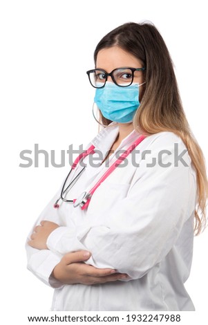 Caucasian doctor woman with pink stethoscope and mask on a white background.