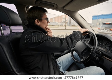 Caucasian driver checking route and thinking while driving