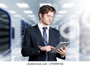 Caucasian IT engineer activating digital database server room with a digital tablet.