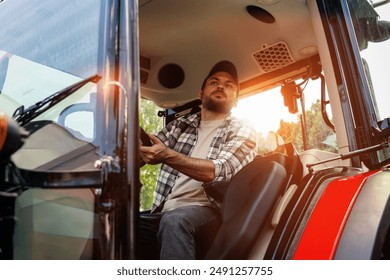 Caucasian ethnicity man driving farm or construction tractor. - Powered by Shutterstock