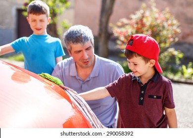 Caucasian Family Car Wash On Sunny Day