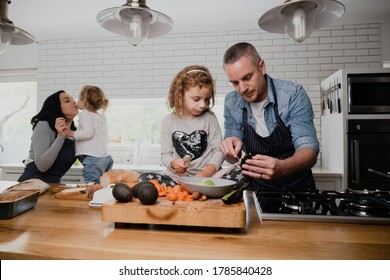 Caucasian family cooking in the kitchen together, spending quality time on fathers day