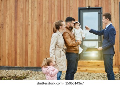 Caucasian family of four stand outdoor near new house just sold. - Shutterstock ID 1506514367