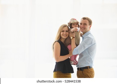 Caucasian Family With Mom Dad And Baby Boy. Image Is Isolated On A White Background.