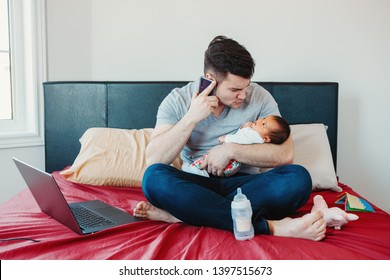 Caucasian Father Dad With Newborn Mixed Race Asian Chinese Baby Working From Home. Male Man Parent Holding Child Daughter Son Talking Over Phone. Single Dad Family. Genderblend Concept