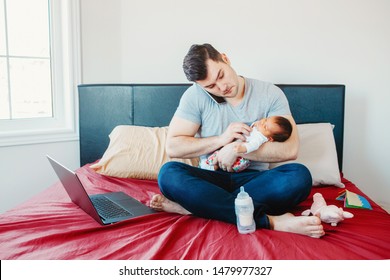 Caucasian Father Dad With Newborn Mixed Race Asian Chinese Baby Working From Home. Male Man Parent Holding Child Daughter Son Talking Over Phone. Single Dad Family. Genderblend Concept