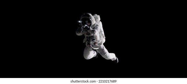 Caucasian female astronaut using her mobile phone during spacewalk, messaging, taking pictures - Powered by Shutterstock