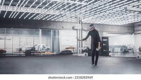 Caucasian Female Car Designer Wearing Virtual Reality Headset and Using Controllers to Work on Concept Car Or Aerodynamics. Talented Design Professional Working in VR Set to Analyze, Test the Vehicle. - Powered by Shutterstock