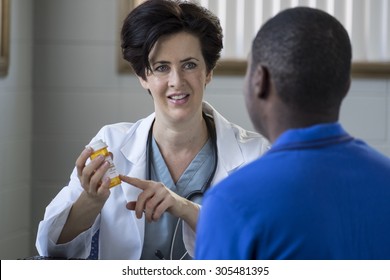 Caucasian Female Doctor And African American Male Patient