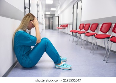 Caucasian Female Doctor Sitting On The Floor