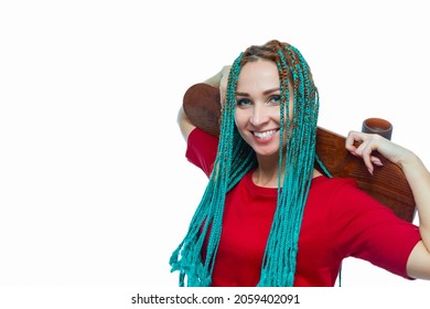 Caucasian Female with Green African American Dreadlocks Posing With Skateboard Over Shoulders On White In Casual Clothing. Horizontal Shot
