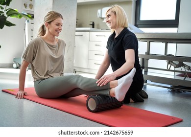 Caucasian female patient has workout with her therapist  - Powered by Shutterstock