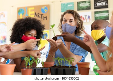 Caucasian Female Teacher Wearing Face Mask At School, Teaching Children At School Classroom. Education Back To School Health Safety During Covid19 Coronavirus Pandemic.