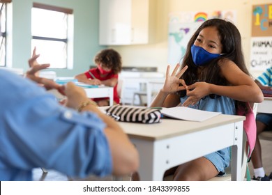 Caucasian Female Teacher Wearing Face Mask At School, Teaching Children At School Classroom. Education Back To School Health Safety During Covid19 Coronavirus Pandemic.