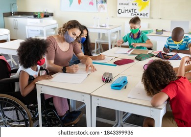 Caucasian Female Teacher Wearing Face Mask At School, Teaching Children At School Classroom. Education Back To School Health Safety During Covid19 Coronavirus Pandemic.