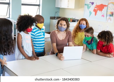 Caucasian Female Teacher Wearing Face Mask At School, Teaching Children At School Classroom. Education Back To School Health Safety During Covid19 Coronavirus Pandemic.