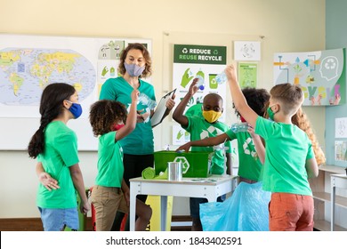 Caucasian Female Teacher Wearing Face Mask At School, Teaching Children At School Classroom. Education Back To School Health Safety During Covid19 Coronavirus Pandemic.