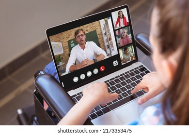 Caucasian Girl With Disability Studying Online Over Video Call On Laptop While Sitting On Wheelchair. Home, Physical Impairment, Unaltered, Childhood, Technology, Education, Student And E-learning.