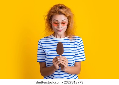 caucasian girl with icelolly ice cream on background. photo of girl with icelolly ice cream